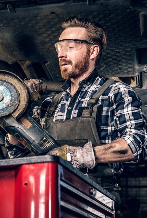 mechanic-in-protective-googles-holds-angle-grinder-small.jpg